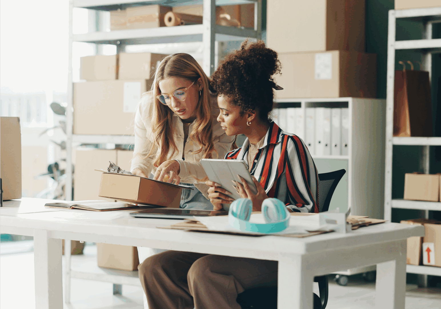 Two women working in an office.